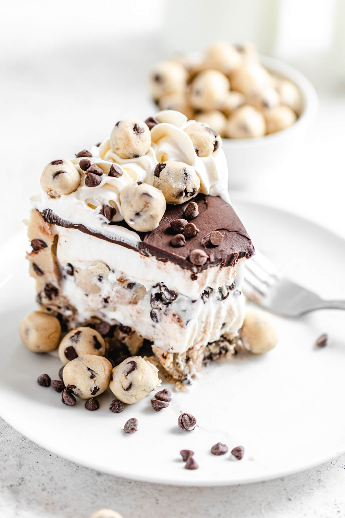 half eaten slice of ice cream cake on a white plate