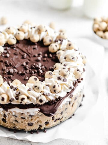 ice cream cake on a parchment covered platter