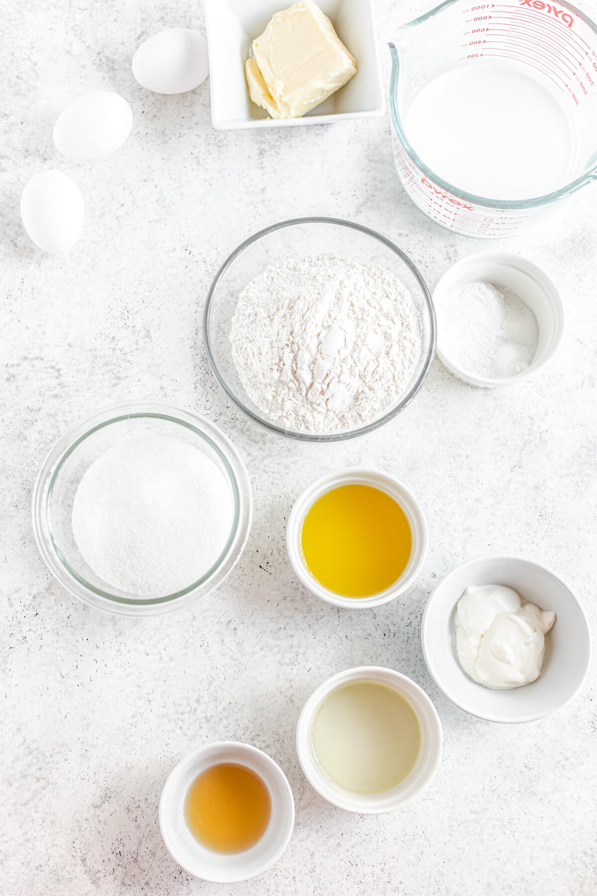 ingredients for pina colada cupcakes in separate bowls