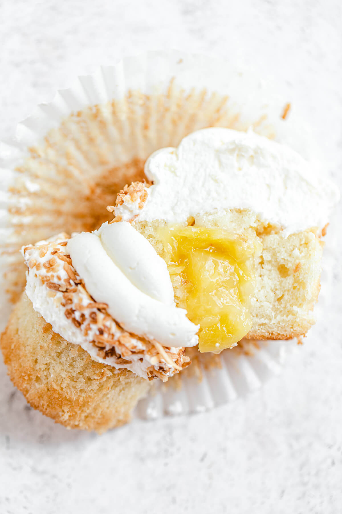 halved cupcake with pineapple filling inside