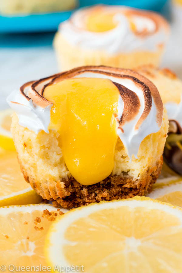 These Mini Lemon Meringue Cheesecakes are incredibly delicious and full of fresh lemon flavour! They’re made with a buttery graham cracker crust, creamy lemon cheesecake filling, and are topped with a ring of toasted meringue with tart lemon curd in the centre. A fun bite-sized treat for summer!