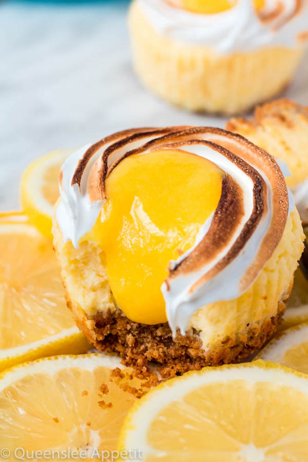 These Mini Lemon Meringue Cheesecakes are incredibly delicious and full of fresh lemon flavour! They’re made with a buttery graham cracker crust, creamy lemon cheesecake filling, and are topped with a ring of toasted meringue with tart lemon curd in the centre. A fun bite-sized treat for summer!