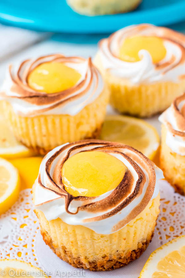 These Mini Lemon Meringue Cheesecakes are incredibly delicious and full of fresh lemon flavour! They’re made with a buttery graham cracker crust, creamy lemon cheesecake filling, and are topped with a ring of toasted meringue with tart lemon curd in the centre. A fun bite-sized treat for summer!