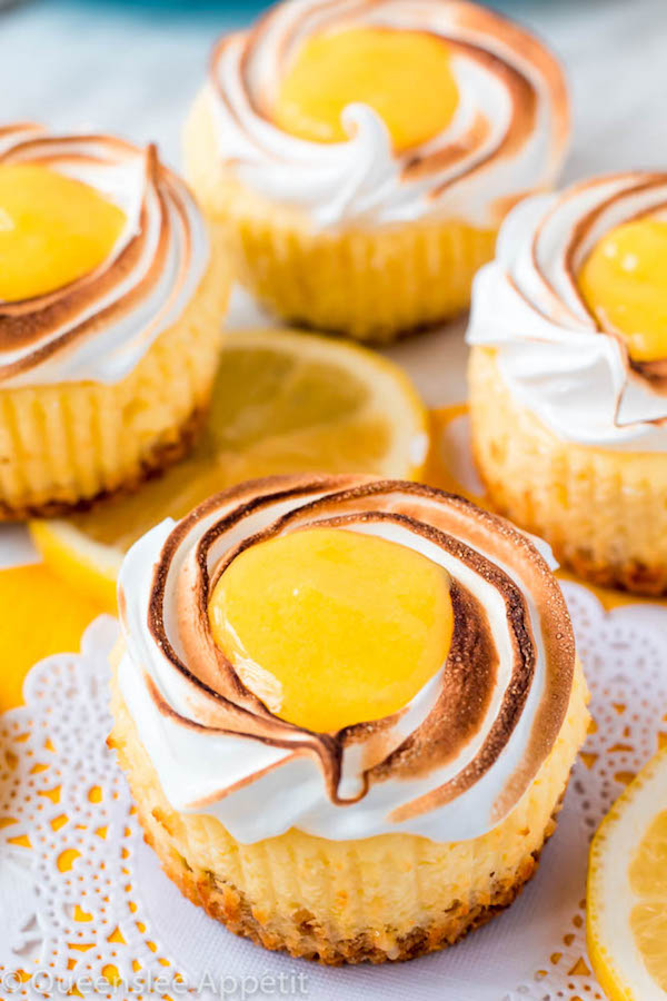 These Mini Lemon Meringue Cheesecakes are incredibly delicious and full of fresh lemon flavour! They’re made with a buttery graham cracker crust, creamy lemon cheesecake filling, and are topped with a ring of toasted meringue with tart lemon curd in the centre. A fun bite-sized treat for summer!