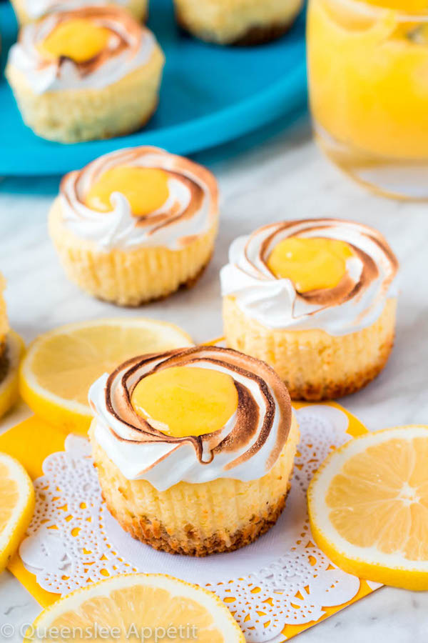 These Mini Lemon Meringue Cheesecakes are incredibly delicious and full of fresh lemon flavour! They’re made with a buttery graham cracker crust, creamy lemon cheesecake filling, and are topped with a ring of toasted meringue with tart lemon curd in the centre. A fun bite-sized treat for summer!