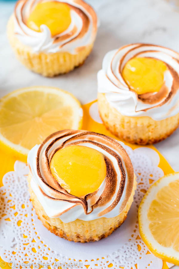 These Mini Lemon Meringue Cheesecakes are incredibly delicious and full of fresh lemon flavour! They’re made with a buttery graham cracker crust, creamy lemon cheesecake filling, and are topped with a ring of toasted meringue with tart lemon curd in the centre. A fun bite-sized treat for summer!