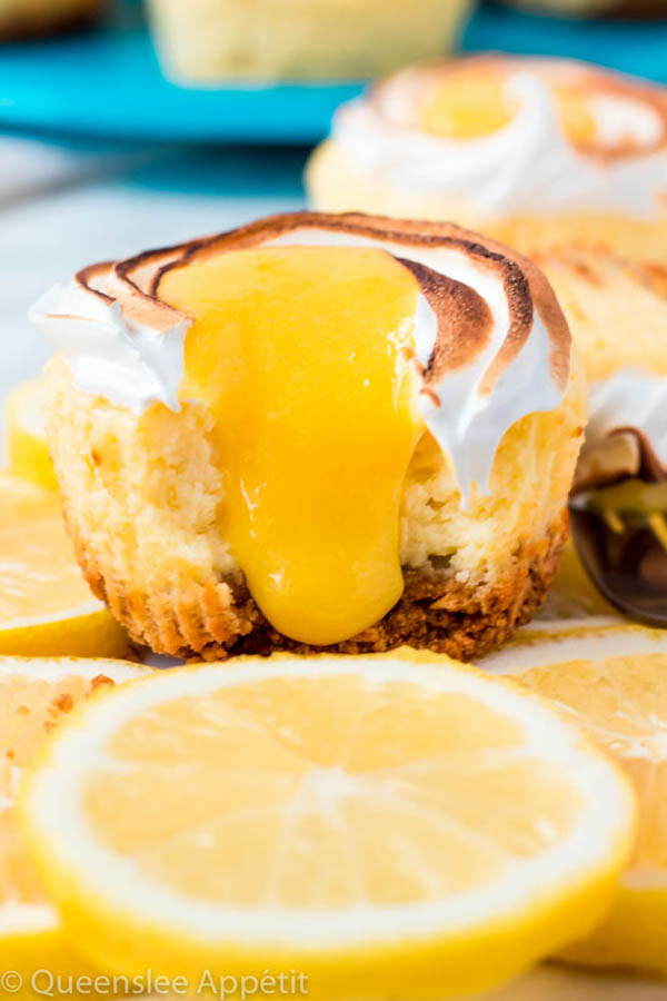 These Mini Lemon Meringue Cheesecakes are incredibly delicious and full of fresh lemon flavour! They’re made with a buttery graham cracker crust, creamy lemon cheesecake filling, and are topped with a ring of toasted meringue with tart lemon curd in the centre. A fun bite-sized treat for summer!