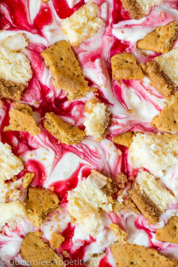 This No-Churn Strawberry Cheesecake Ice Cream consists of a cheesecake flavoured ice cream base that’s loaded with cheesecake and graham cracker pieces and a swirl of sweet homemade strawberry sauce. This simple and delicious dessert just screams summer!