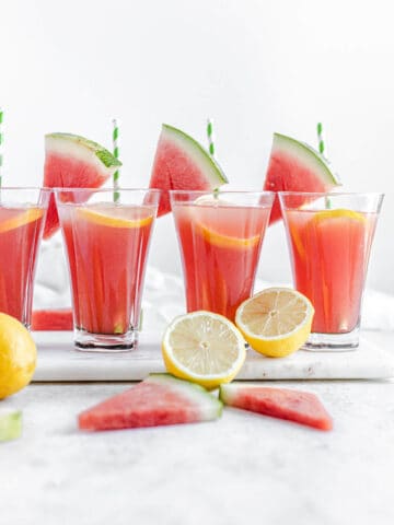 four glasses of lemonade on a marble board