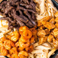Cajun Shrimp Chicken and Steak Alfredo Pasta