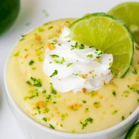 This Key Lime Pie Pudding is sweet, tangy and creamy. Each bite tastes just like a key lime pie! Top this key lime pudding off with whipped cream, crushed graham crackers and a slice of lime for a delightful summer treat! 