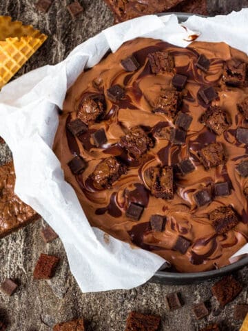 This No-Churn Brownie Fudge Swirl Ice Cream is for hardcore chocolate lovers only. This rich and creamy chocolate ice cream is loaded with chocolate chunks, chunks of brownies and swirled with silky ganache! 