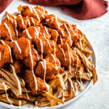 large plate of buffalo chicken nuggets and fries