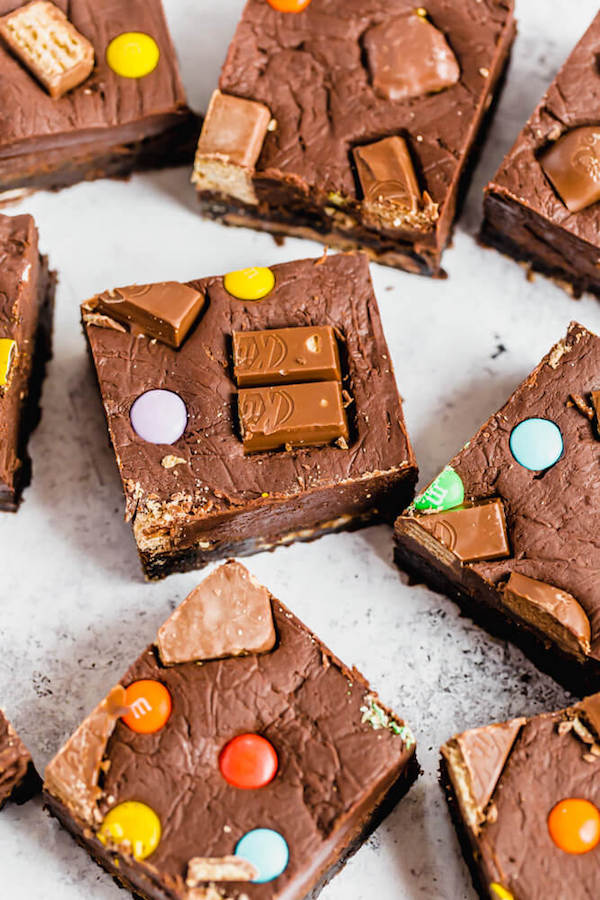 brownies topped with fudge and stuffed with halloween candy