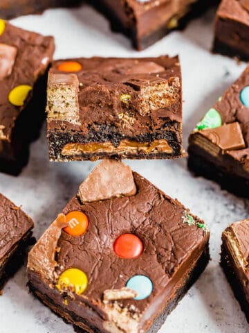 brownies topped with fudge and stuffed with halloween candy