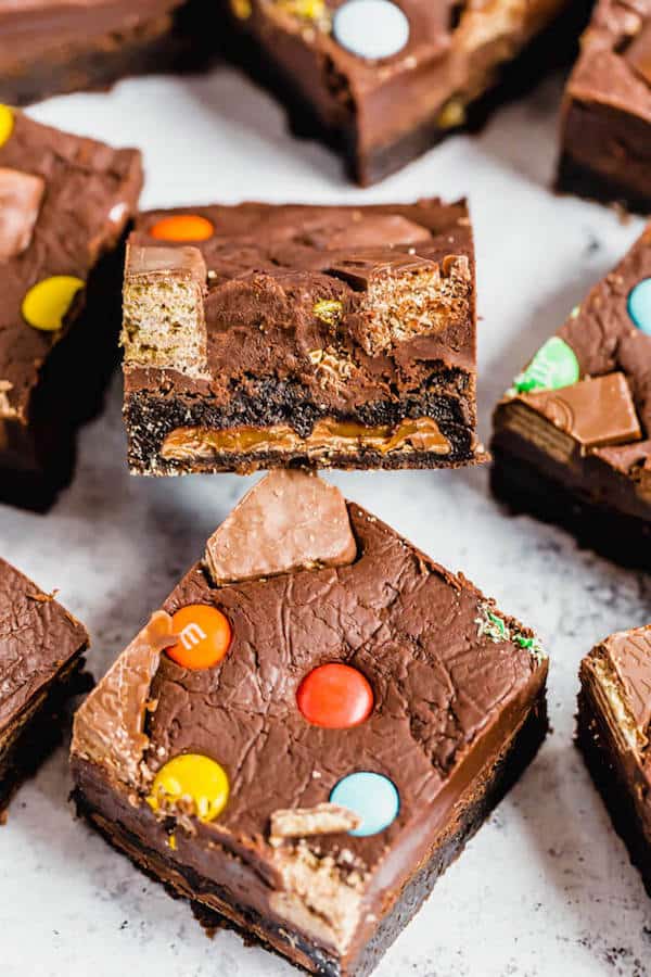 brownies topped with fudge and stuffed with halloween candy