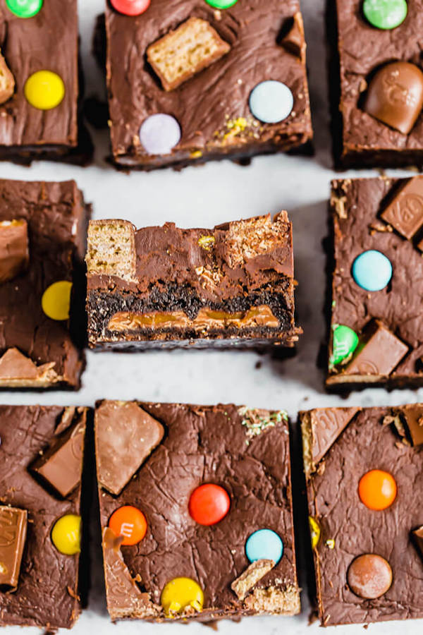 brownies topped with fudge and stuffed with halloween candy