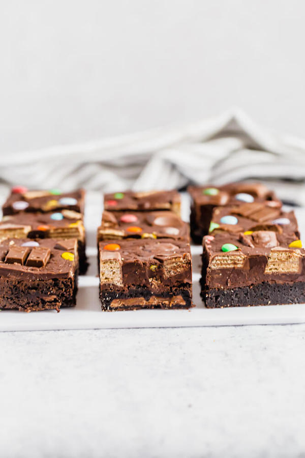 brownies topped with fudge and stuffed with halloween candy