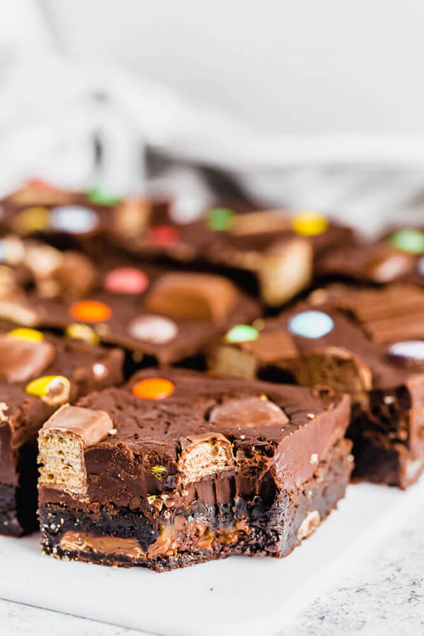 brownies topped with fudge and stuffed with halloween candy