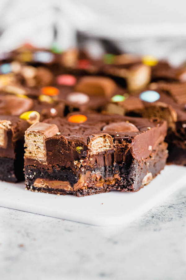 brownies topped with fudge and stuffed with halloween candy