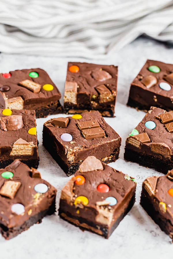 brownies topped with fudge and stuffed with halloween candy