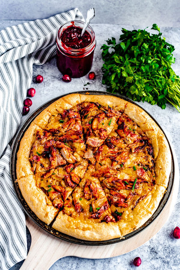 pizza on a pizza pan and pizza stone