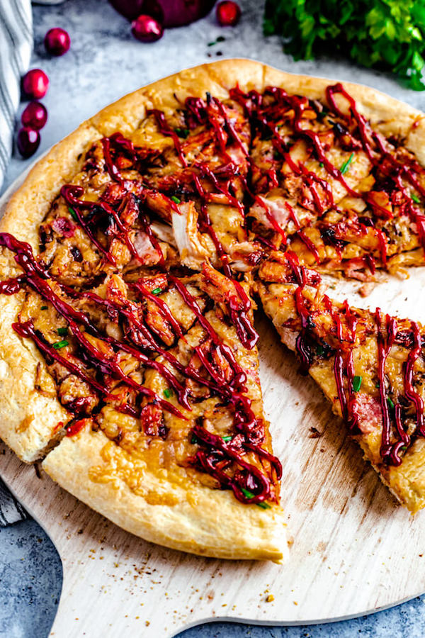 sliced pizza with a drizzle of cranberry bbq sauce 