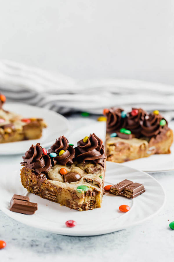 cookie cake loaded with halloween candy and topped with chocolate buttercream