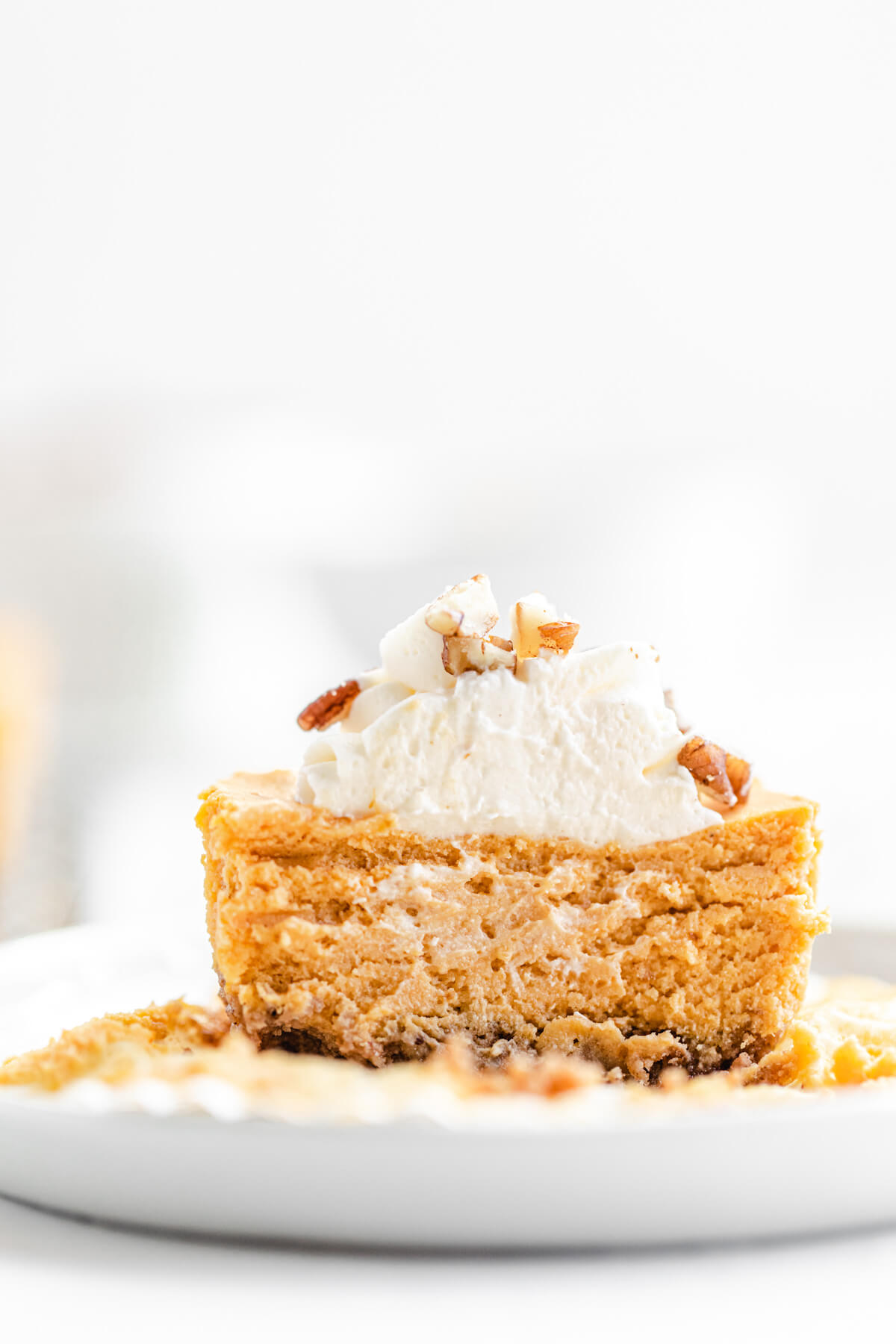 halved mini cheesecake in a small white plate