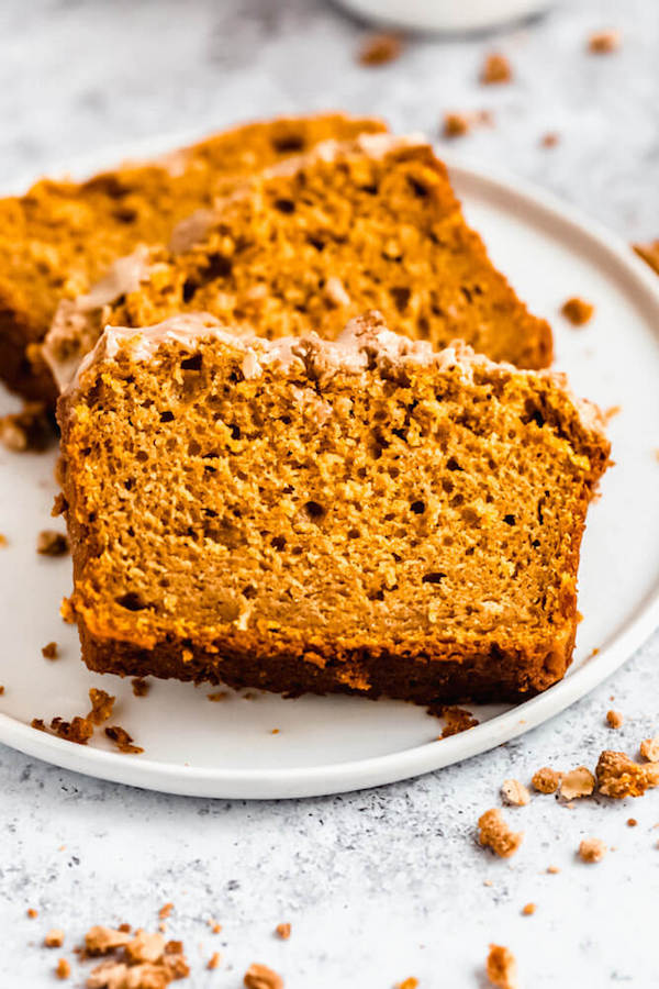 three slices of pumpkin streusel bread on a plate