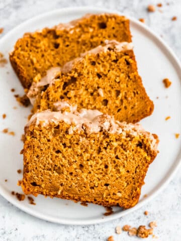 three slices of pumpkin streusel bread on a plate