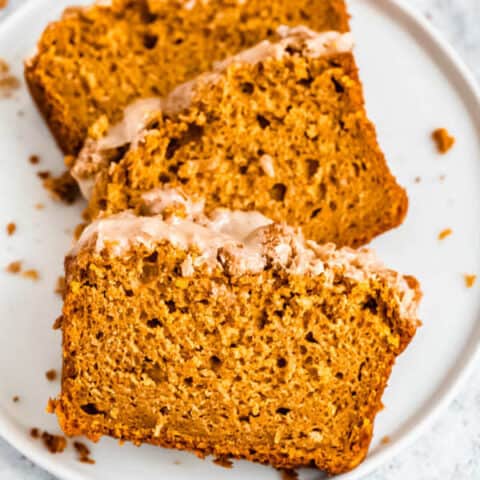 three slices of pumpkin streusel bread on a plate