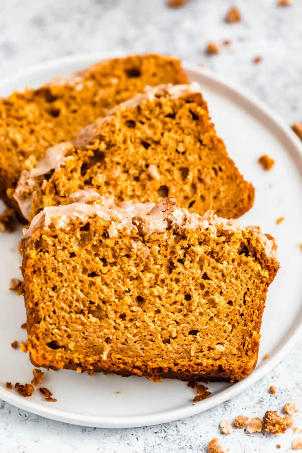 three slices of pumpkin streusel bread on a plate