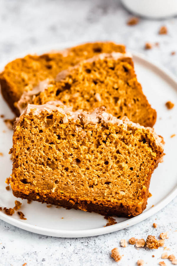 three slices of pumpkin streusel bread on a plate