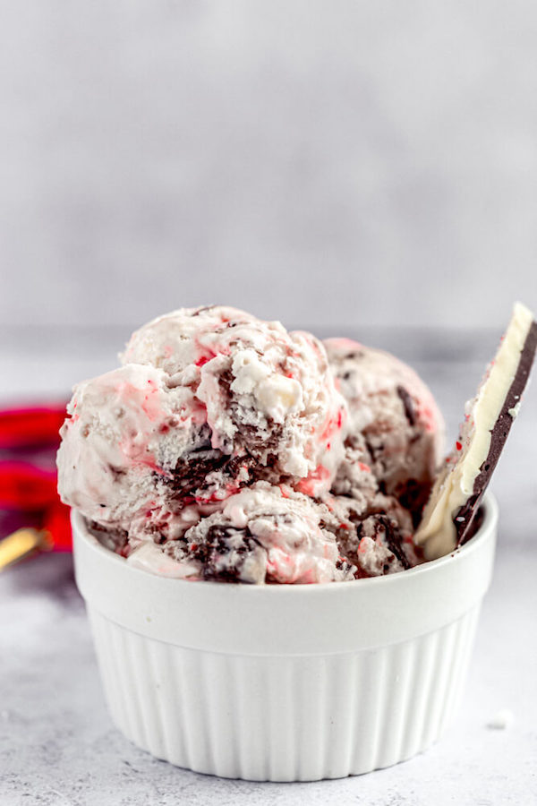 ice cream in a ramekin with peppermint bark on side