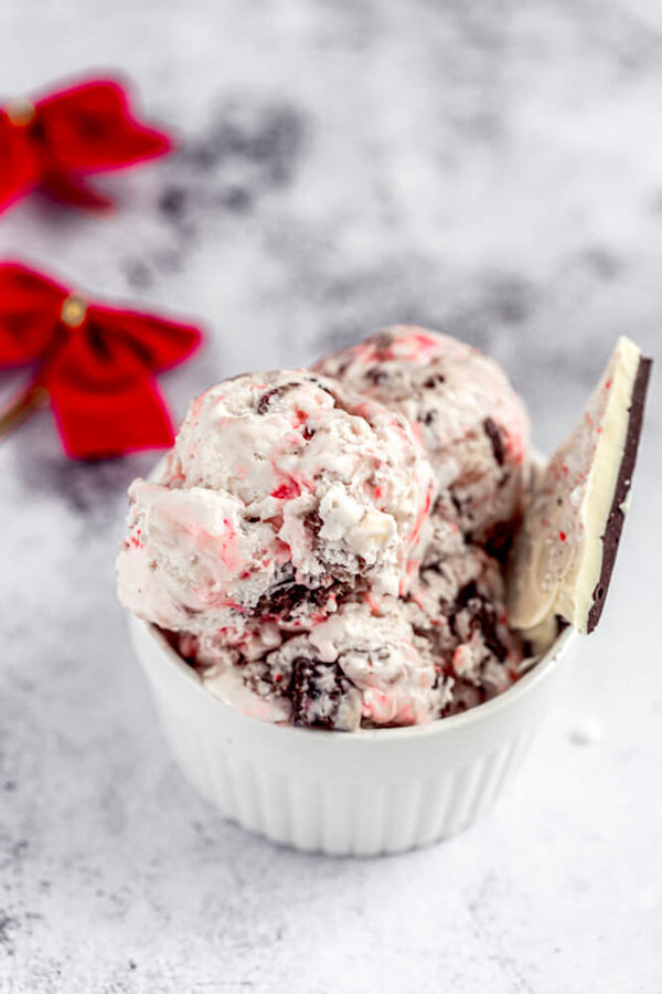 ice cream in a ramekin with peppermint bark on side