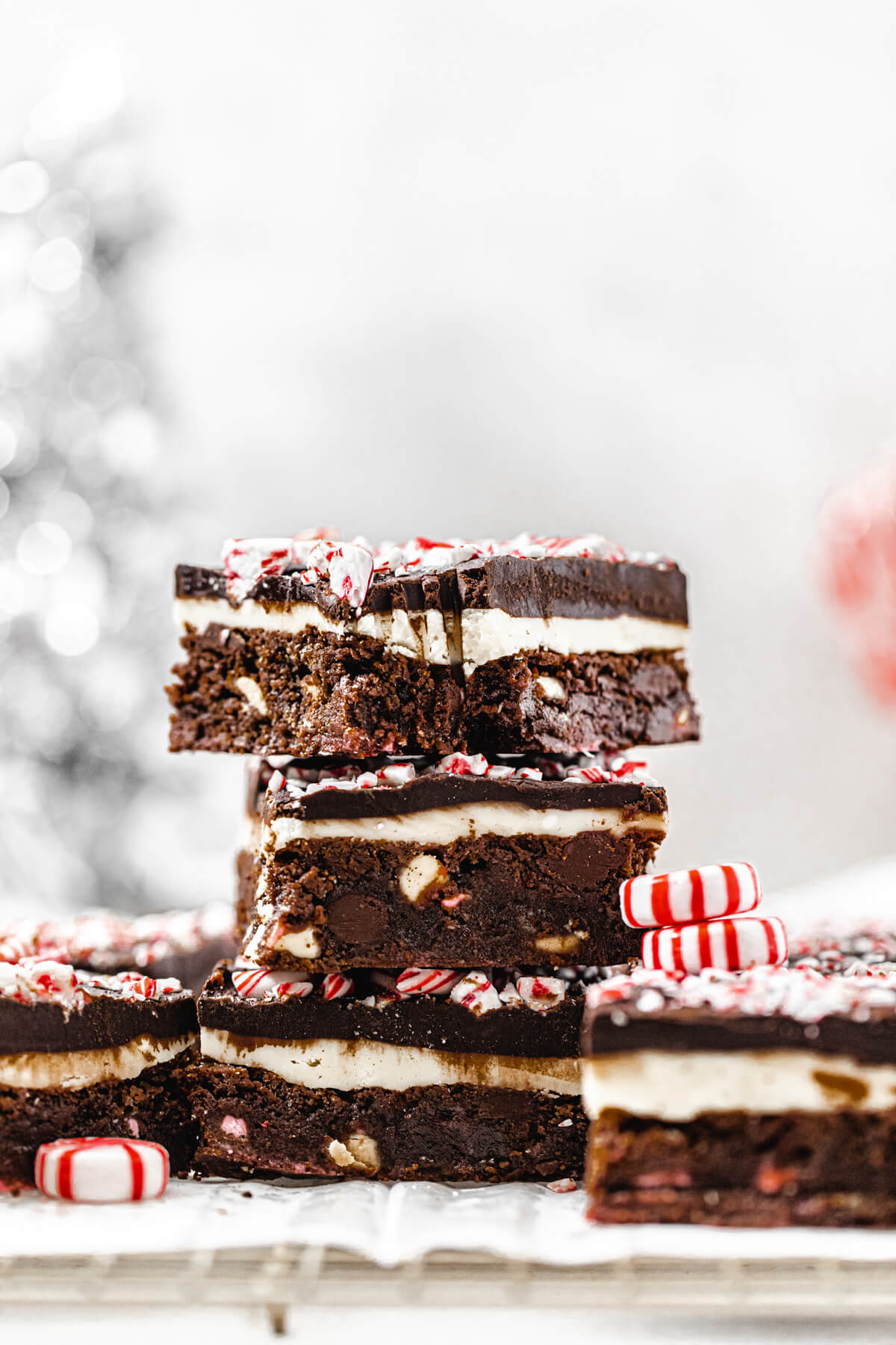 stack of brownies on a wire rack with bite taken out of top one