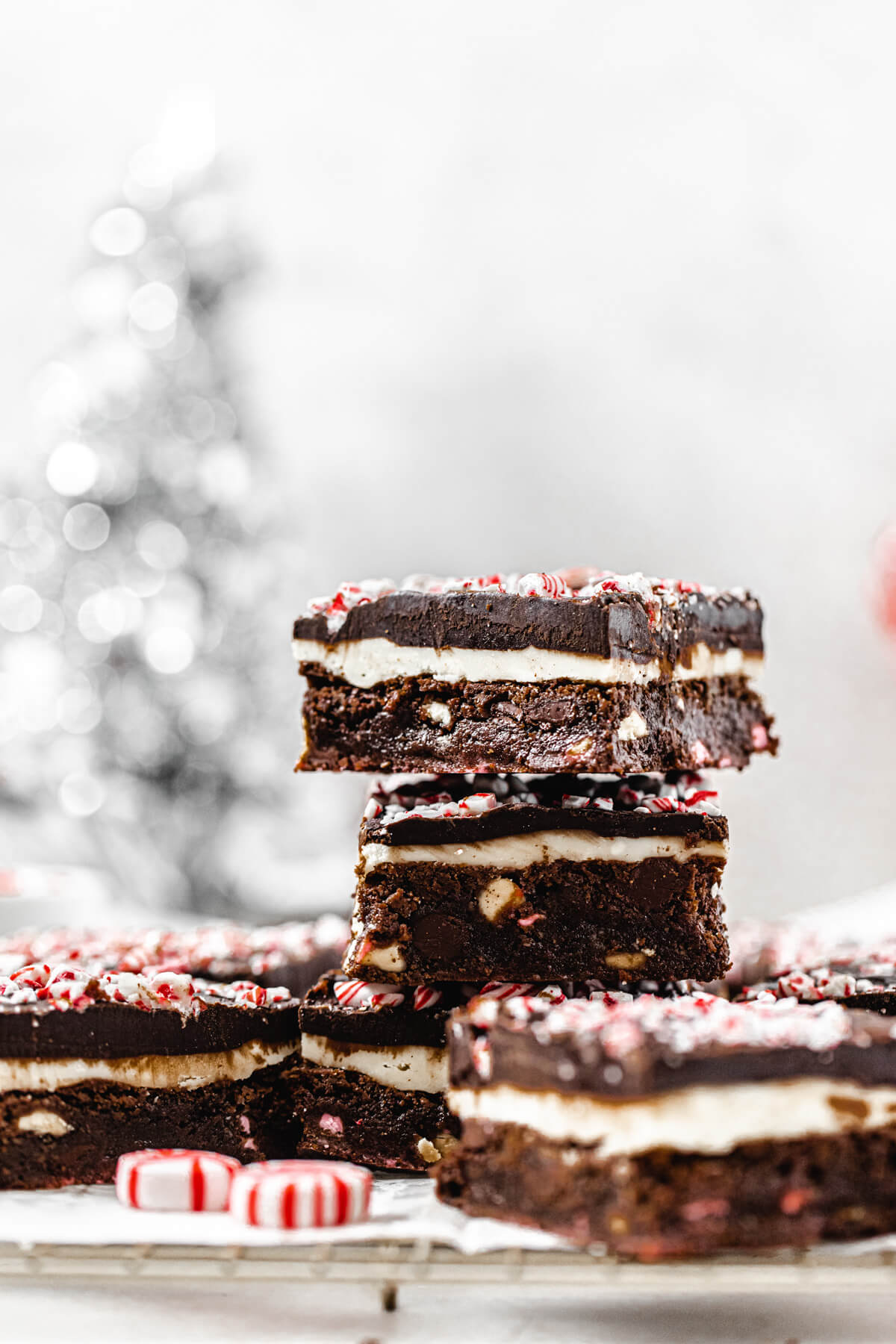 stack of brownies with peppermints in front of them