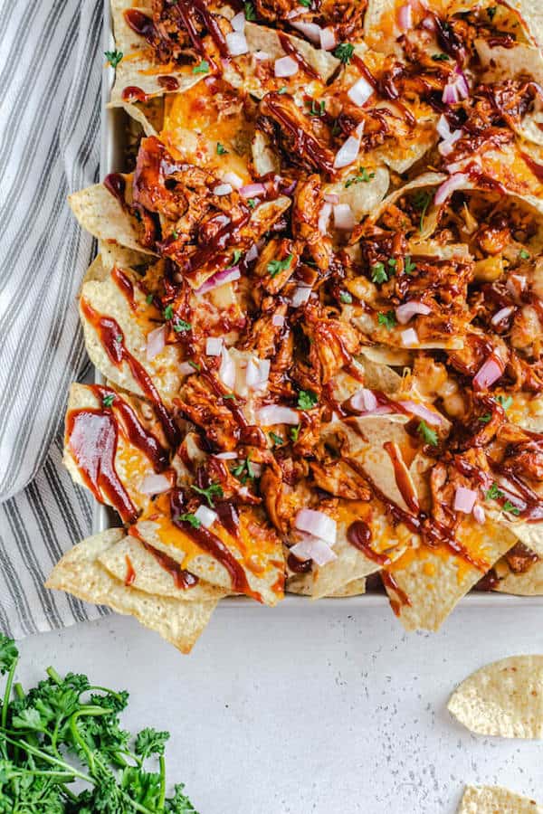 half shot of nachos on baking sheet