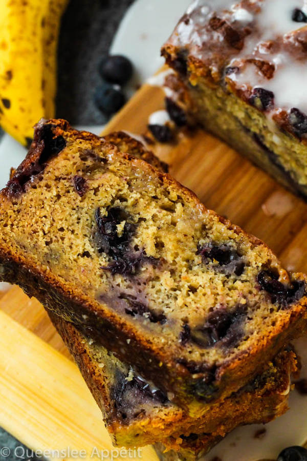 This Blueberry Banana Bread is soft, moist and fluffy and packed with fresh blueberries. Top it off with a sweet lemon glaze for a burst of citrus flavours!   
