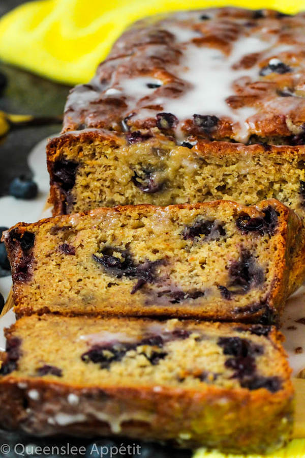 This Blueberry Banana Bread is soft, moist and fluffy and packed with fresh blueberries. Top it off with a sweet lemon glaze for a burst of citrus flavours!   