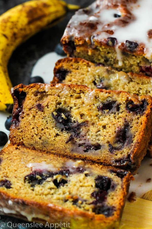 This Blueberry Banana Bread is soft, moist and fluffy and packed with fresh blueberries. Top it off with a sweet lemon glaze for a burst of citrus flavours!   