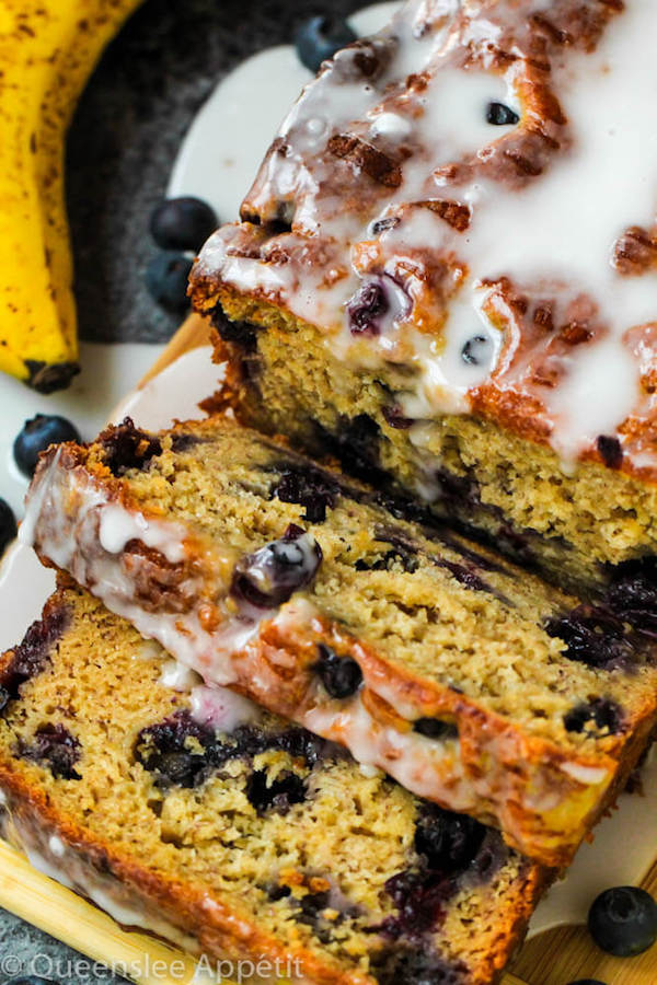 This Blueberry Banana Bread is soft, moist and fluffy and packed with fresh blueberries. Top it off with a sweet lemon glaze for a burst of citrus flavours!   