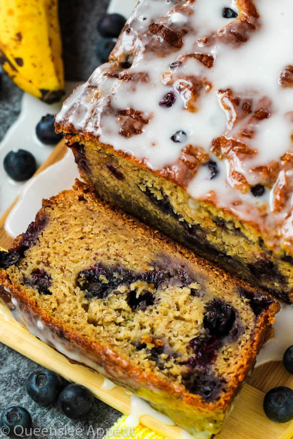 This Blueberry Banana Bread is soft, moist and fluffy and packed with fresh blueberries. Top it off with a sweet lemon glaze for a burst of citrus flavours!   