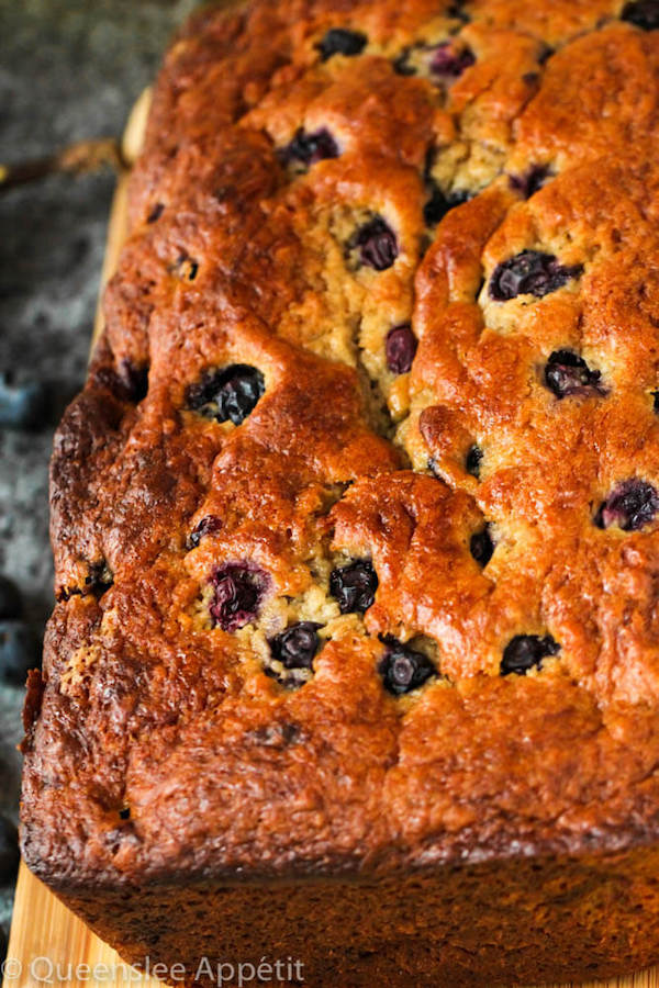 This Blueberry Banana Bread is soft, moist and fluffy and packed with fresh blueberries. Top it off with a sweet lemon glaze for a burst of citrus flavours!   