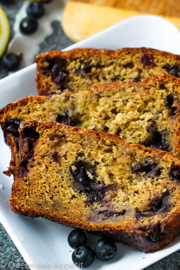 This Blueberry Banana Bread is soft, moist and fluffy and packed with fresh blueberries. Top it off with a sweet lemon glaze for a burst of citrus flavours!   