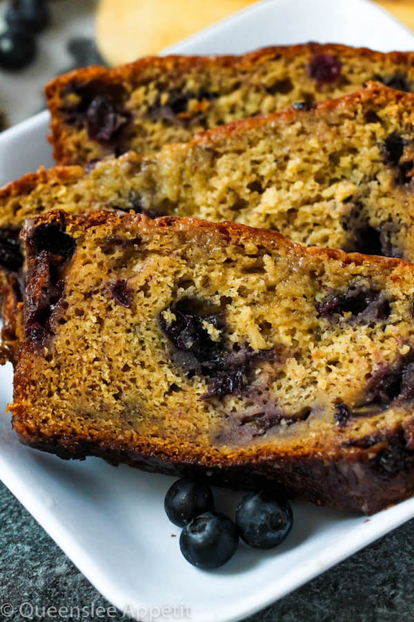 This Blueberry Banana Bread is soft, moist and fluffy and packed with fresh blueberries. Top it off with a sweet lemon glaze for a burst of citrus flavours!   