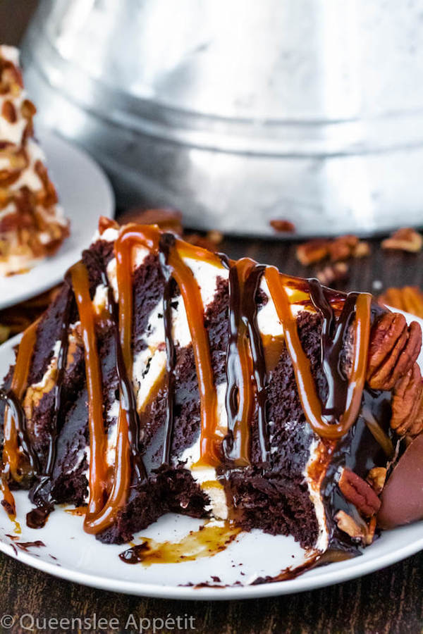 This Turtle Chocolate Layer Cake starts with rich, decadent and moist chocolate cake layers that are filled with a caramel pecan sauce and covered in a smooth caramel frosting, then finished off with a caramel and ganache drip and chopped pecans! 