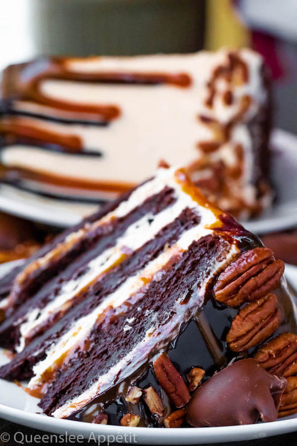 This Turtle Chocolate Layer Cake starts with rich, decadent and moist chocolate cake layers that are filled with a caramel pecan sauce and covered in a smooth caramel frosting, then finished off with a caramel and ganache drip and chopped pecans! 