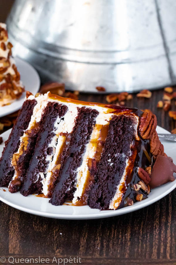 This Turtle Chocolate Layer Cake starts with rich, decadent and moist chocolate cake layers that are filled with a caramel pecan sauce and covered in a smooth caramel frosting, then finished off with a caramel and ganache drip and chopped pecans! 